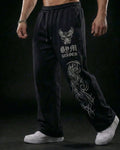 Pantalones baggy negros THE PHOENIX de Reaper con gráficos tribales de gran formato en la pierna, confeccionados en tejido pesado de alta densidad.